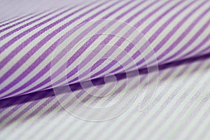 Close up roll purple and white strip fabric of shirt