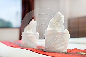 Close up of roll towel on bed decoration interior of hotel bedrooms, selective focus
