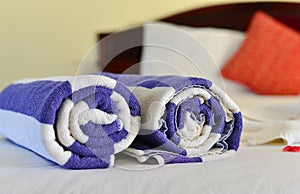 Close-up of rolled up blue bath towel