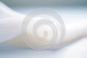 close-up of a rolled white gauze on a clean surface