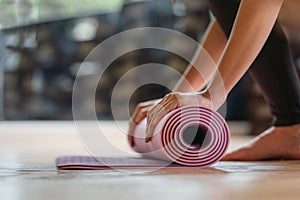 Close-up rolling yoga mat after working out at fitness ,sport and training club