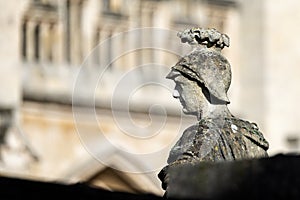 Close up of Roman statue on the terrace of the Roman Baths, Bath, Somerset, UK