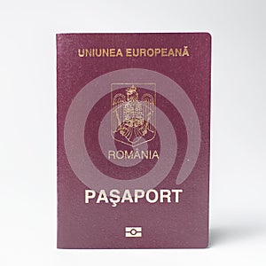 Close-up of Romanian passport isolated on white background.