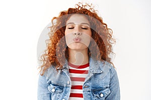 Close-up romantic cute feminine silly redhead girl curly hairstyle prepared lips kiss folding mouth close eyes wanna
