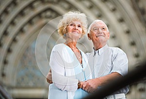 Close up of romantic senior couple on city streets on joint vacation