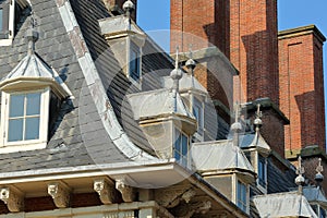 Close-up on the roof of the town hall Stadhuis with details of carvings