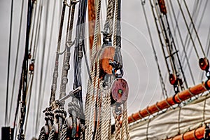 Close up of the ropes, lines, masts and sails of a tall ship