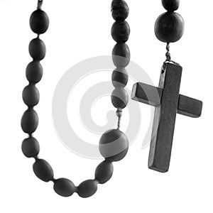 Close up rosary isolated on white background. Selactive focus on cross. Christianity, religion, faith concept