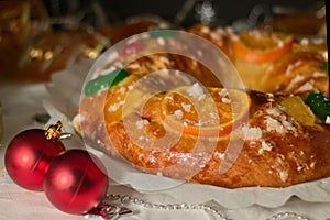 Close-up of a roscÃ³n reyes with candied fruit and pearl sugar