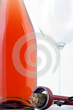 Close-up of rose wine on white background