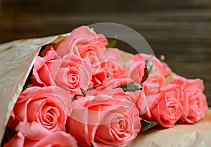 Close up on roses over wooden table