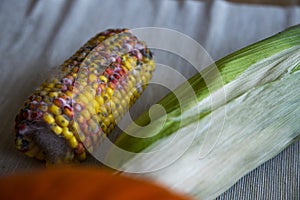 Close up on rotten corn on the table