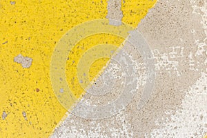 Close-up of rough speed bump in yellow and black color texture,