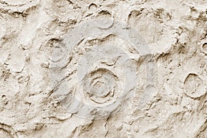 Close-up of rough stone concrete wall texture, similar to surface moon. For modern background, pattern, wallpaper or