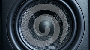 Close-up of round audio speaker pulsating