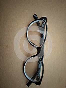 Round eye glasses on texture background
