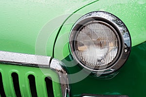 Close up: round car headlight at Classic Soviet Car Exhibition