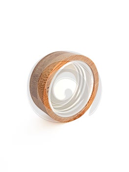 Close up of round wooden screw cap for bottle. Front view of inside of wooden plug. Isolated bottle lid. Ecological and
