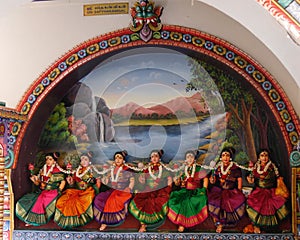 Close up of row of colourful female figurines, Hindu temple, Singapore