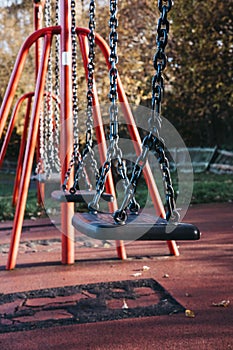 Close up of a row of emplty swings