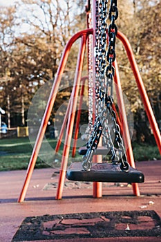 Close up of a row of emplty swings