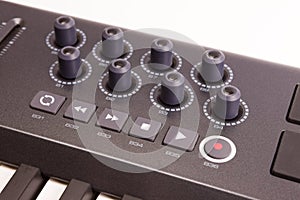 Close-up of a row of knobs on a MIDI controller Keyboard