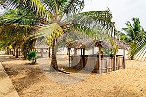 Close up of a row of Seaside thatched huts on Awolowo beach Lekki Lagos Nigeria