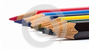 Close Up of Row of Sharpened Colored Pencils on White Background