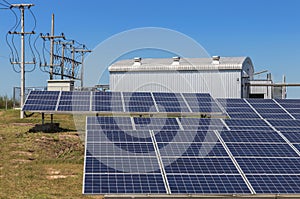 Close up rows array of polycrystalline silicon solar cells or photovoltaics in solar power plant turn up skyward photo