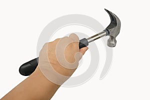 close-up of rubber-handled hammer with nail puller, round head for fine work in female hand, manual universal percussion tool for