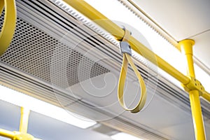 Close up the rubber - plastic cable hand holding in ariport rail link train