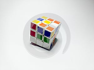 Close up of rubik`s cube isolated on white background