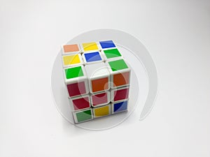 Close up of rubik`s cube isolated on white background