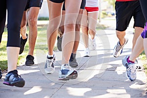 Close Up Of Runners Feet On Suburban Street