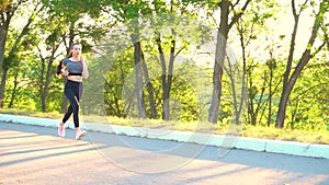 Close up of running fitness woman jogging outdoor.