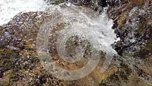 Close-up of running water in a stream, with swirls