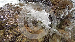 Close-up of running water in a stream, with swirls