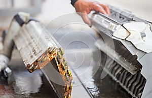 Close up of Rust and dirty inside compartments air conditioner, repairman clean mold in system air conditioning system, Repair and