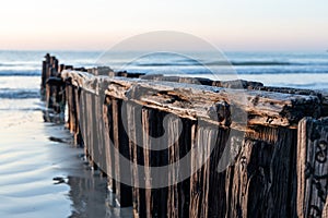 A close up of a rusted bolt with selective focus on the Victor Harbor erosion groyne in South Australia on September 11th 2023