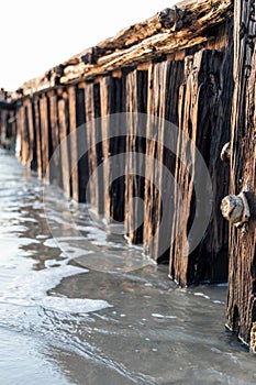 A close up of a rusted bolt with selective focus on the Victor Harbor erosion groyne in South Australia on September 11th 2023