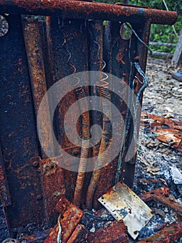 Close up of a rusted and burnt spring