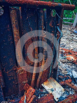 Close up of a rusted and burnt spring