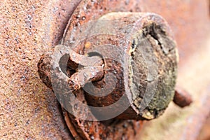 Close up of rusted cotter pin on abandoned farm equipment