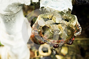 A close up of a rusted valve connects to water supply with metal pipe,Industrial metal water tab,seen in a garden, for watering th