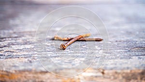 Close up rusty curved nails wintage wooden plank texture background