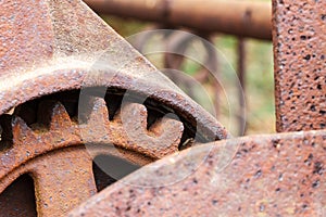 Close up of rusty gear on abandoned farm equipment