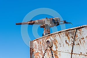 Close-up of rusty harpoon gun in bows