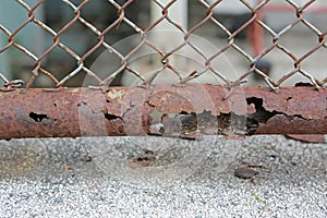 Close up rusty metal wire mesh fence