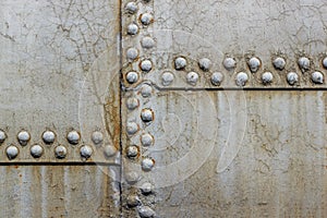 close-up rusty rivets on a gray background
