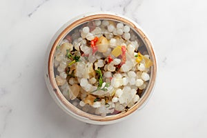 Close-up of Sabudana Khichadi - An authentic dish from Maharashtra made with sago seeds and garnished with coriander leaves served